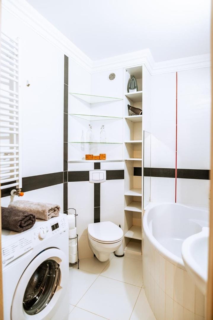 Toilet, Bath, towels, washing machine, dryer