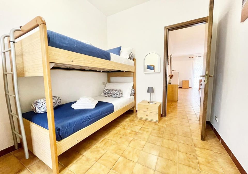 Bed, Photo of the whole room, Bedroom, bunk bed, towels, air conditioner