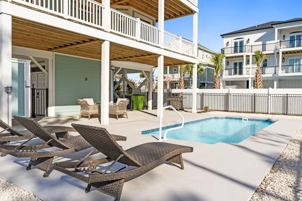 Coastal Charm Ocean Isle Beach custom beach home with 4 bedroom, 3 bath home with pool and elevator House in Ocean Isle Beach