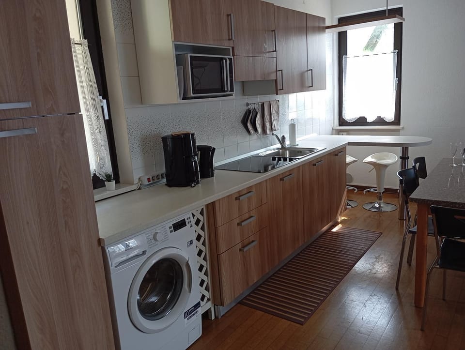 Kitchen or kitchenette, dishwasher, stove, washing machine