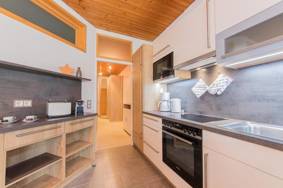 Kitchen or kitchenette, dishwasher, oven, stove, toaster