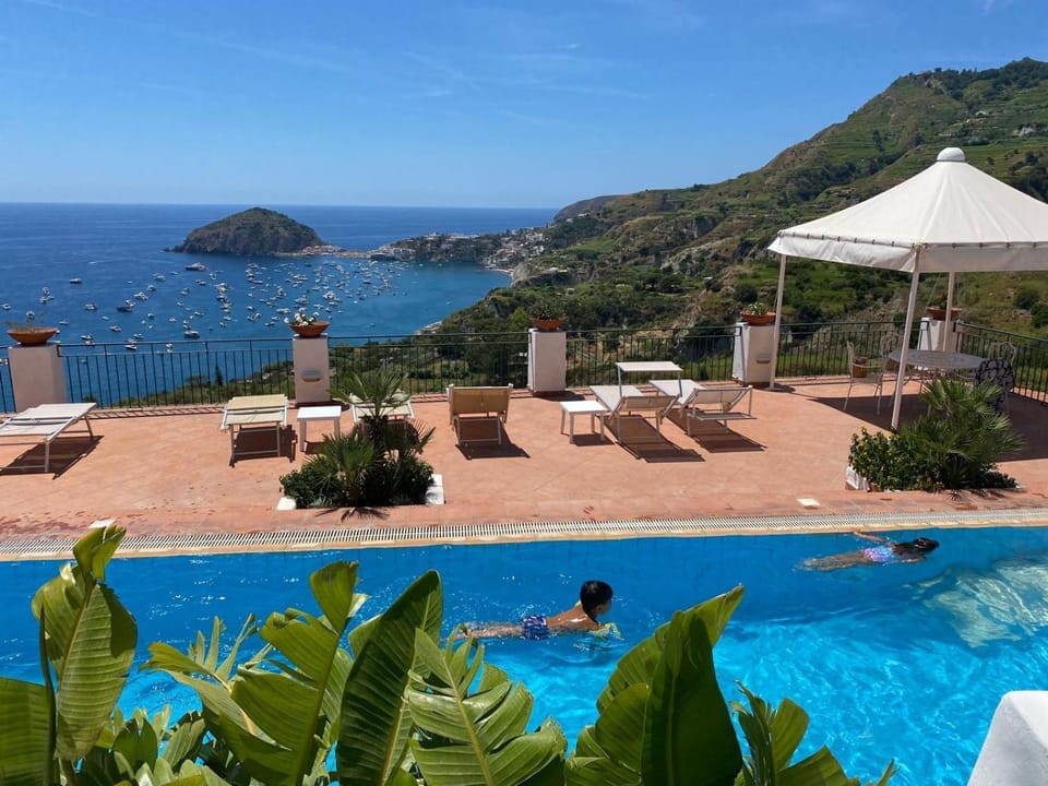 Patio, Day, Natural landscape, Beach, Mountain view, Pool view, Sea view, Swimming pool, sunbed