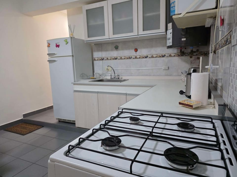 Kitchen or kitchenette, stove, kitchen