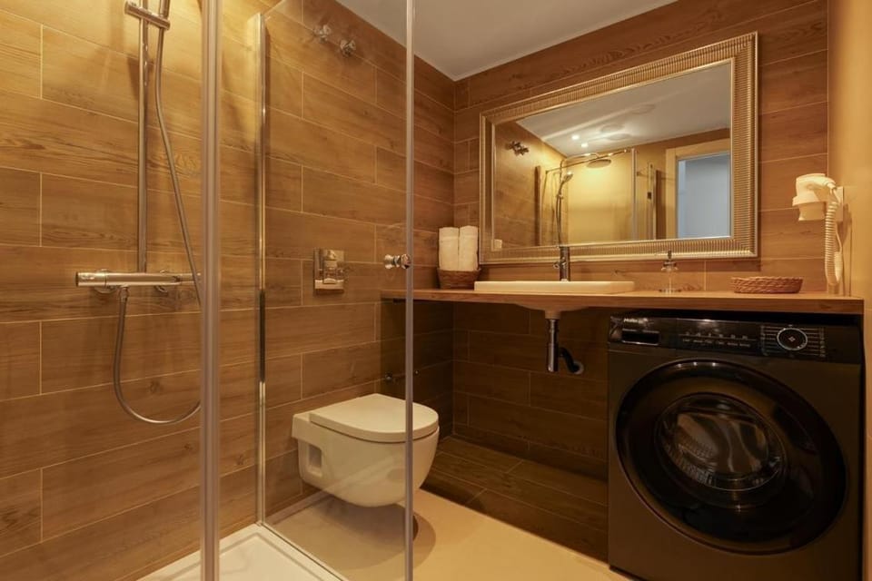 Shower, Toilet, Bathroom, towels, washing machine, dryer