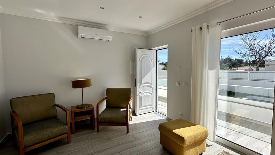 View (from property/room), Balcony/Terrace, Living room, Seating area, air conditioner