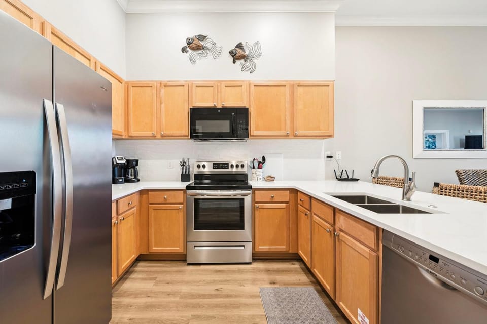 Kitchen or kitchenette, dishwasher, oven, stove