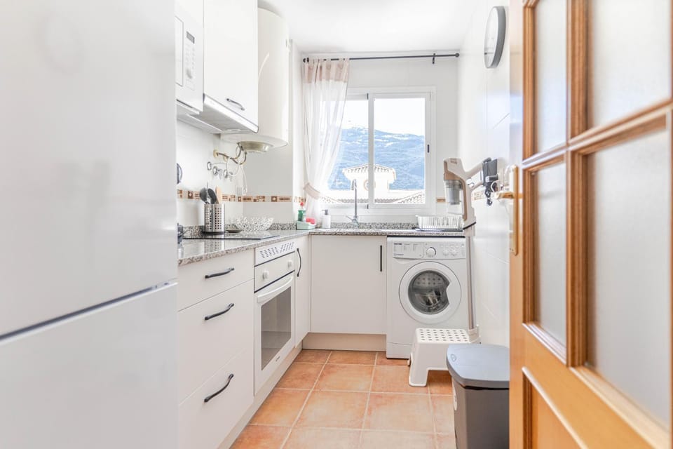 Kitchen or kitchenette, stove, washing machine