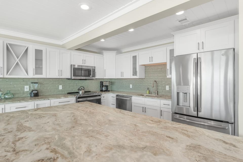 Kitchen or kitchenette, dishwasher, oven, stove