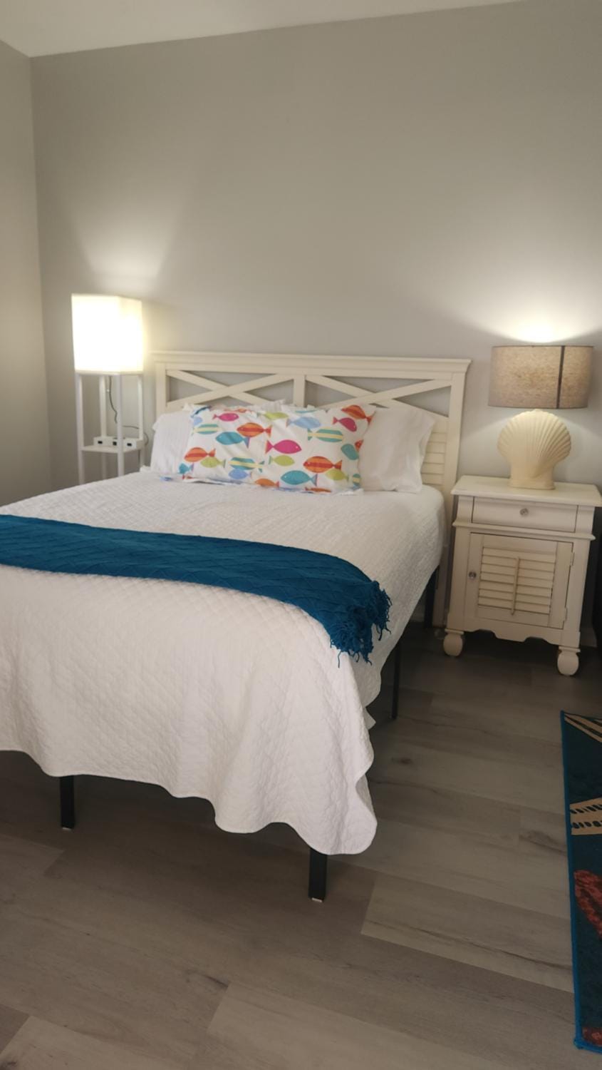 Queen Bed with Sitting Area at IMG Apartment in Longboat Key