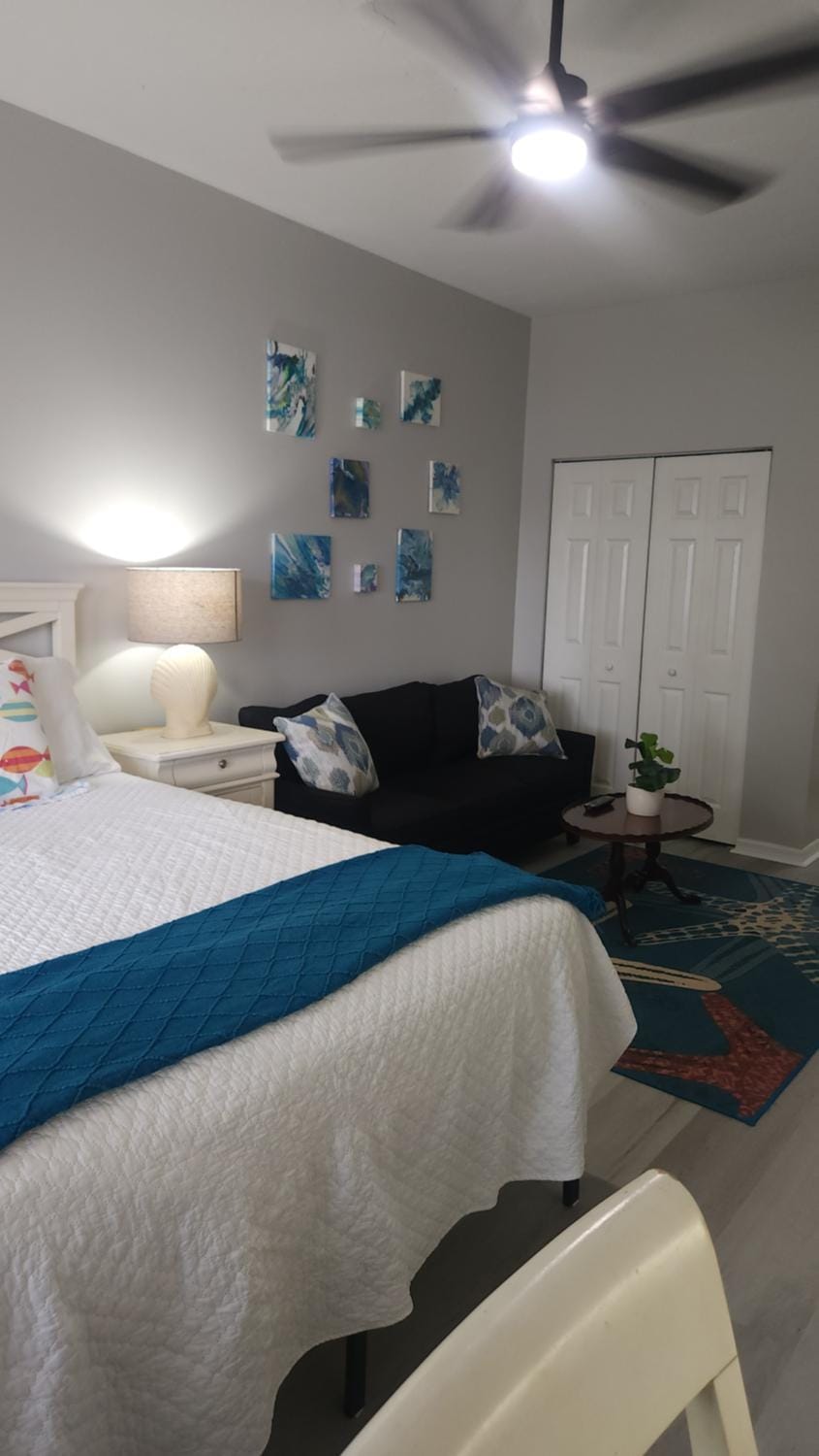 Queen Bed with Sitting Area at IMG Apartment in Longboat Key