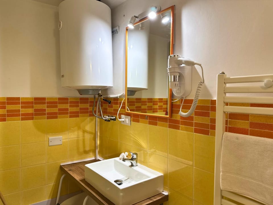 Toilet, Bathroom, hair dryier, towels