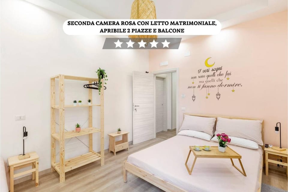 Bed, Photo of the whole room, Bedroom, Text overlay, towels, wardrobe