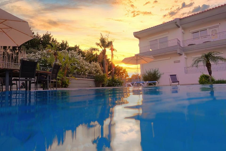 Property building, Day, Pool view, Swimming pool, Sunset, sunbed