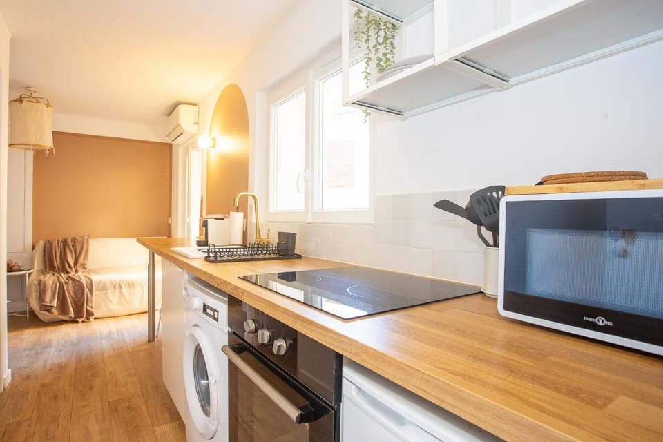 Kitchen or kitchenette, microwave, oven, stove, stove, washing machine, kitchen