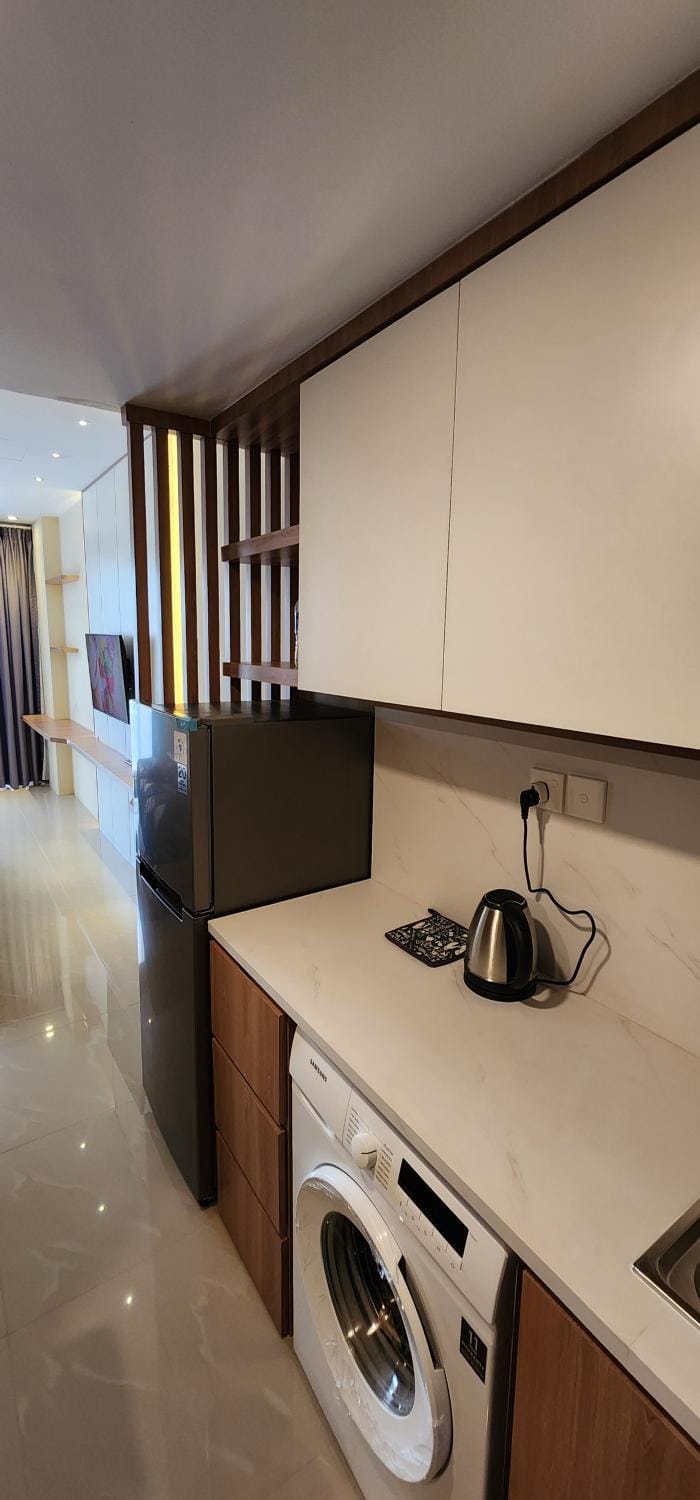 Kitchen or kitchenette, washing machine