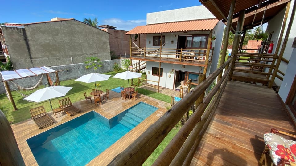Property building, Patio, Day, Garden, View (from property/room), Balcony/Terrace, Pool view, Swimming pool, sunbed
