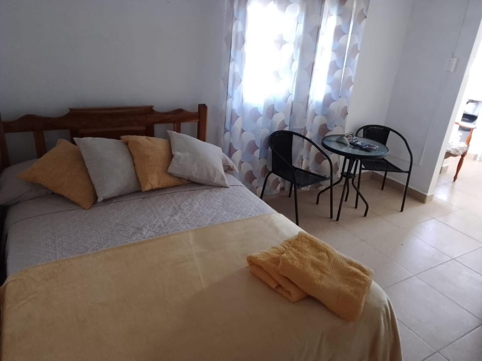Bed, Seating area, Bedroom
