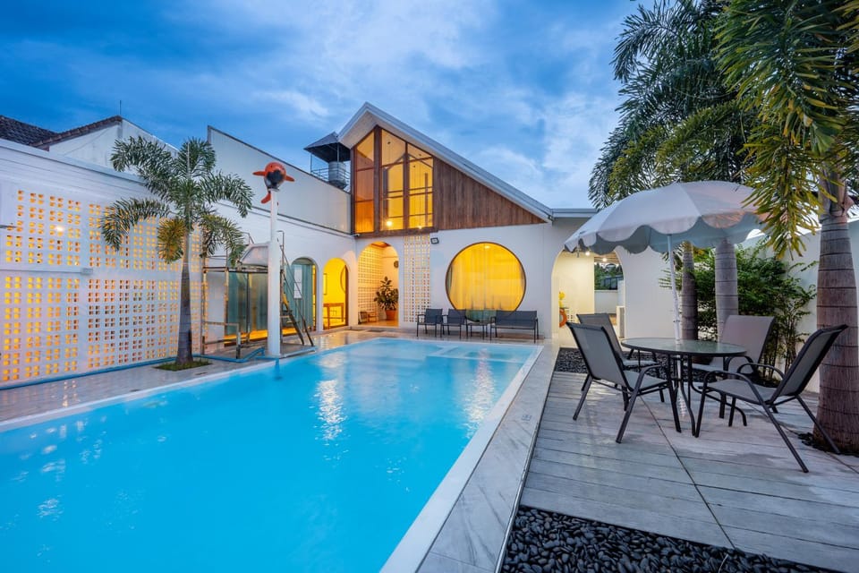 Property building, Patio, Night, Pool view, Swimming pool, sunbed