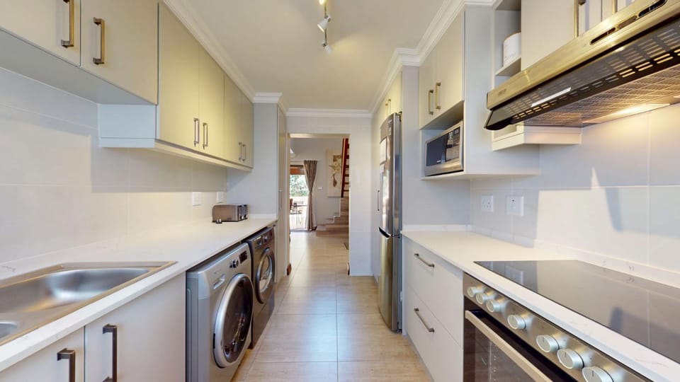 Kitchen or kitchenette, oven, stove, washing machine, dryer