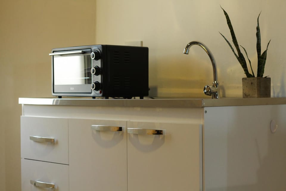 Kitchen or kitchenette, oven