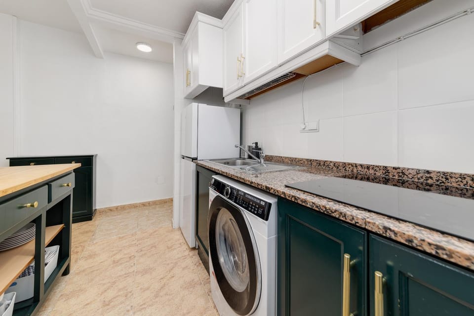 Kitchen or kitchenette, washing machine