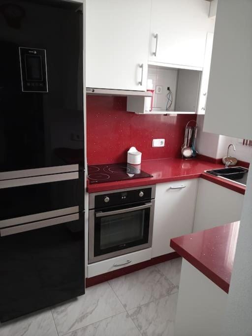 Kitchen or kitchenette, dishwasher, oven, stove, toaster