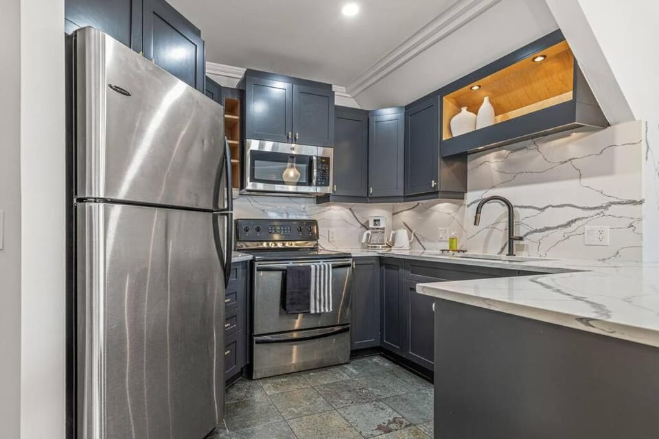 Kitchen or kitchenette, dishwasher, oven, stove