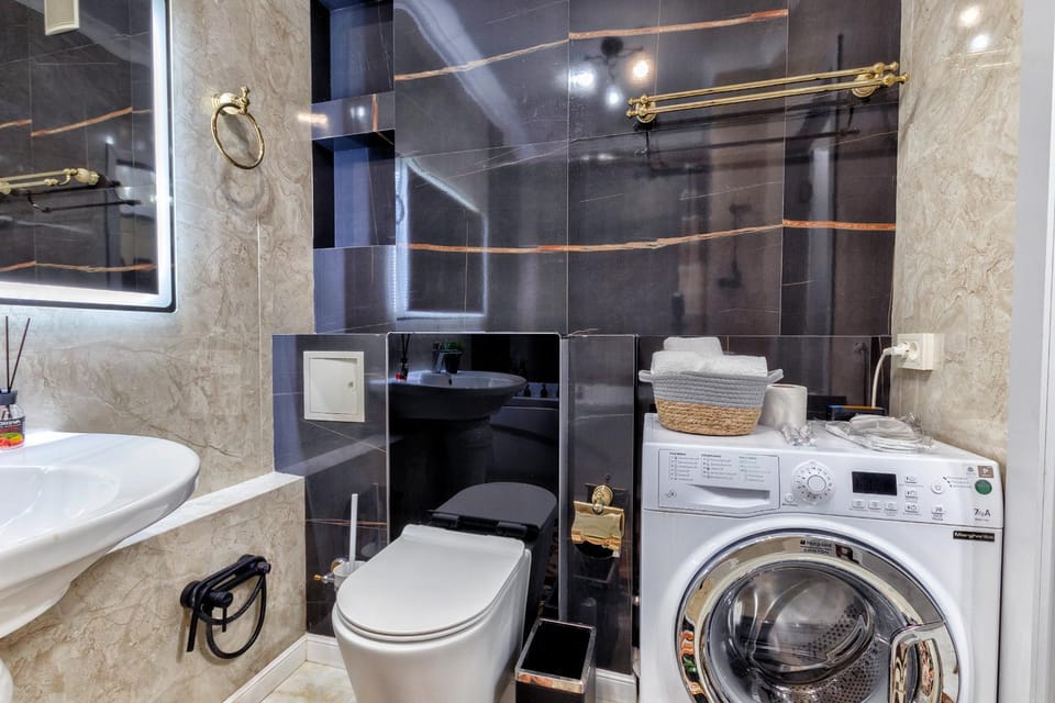Toilet, towels, washing machine