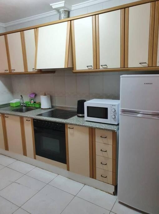 Kitchen or kitchenette, oven, stove