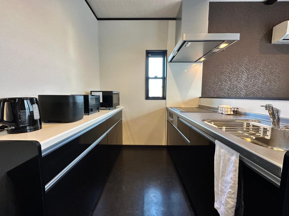 Kitchen or kitchenette, stove, toaster