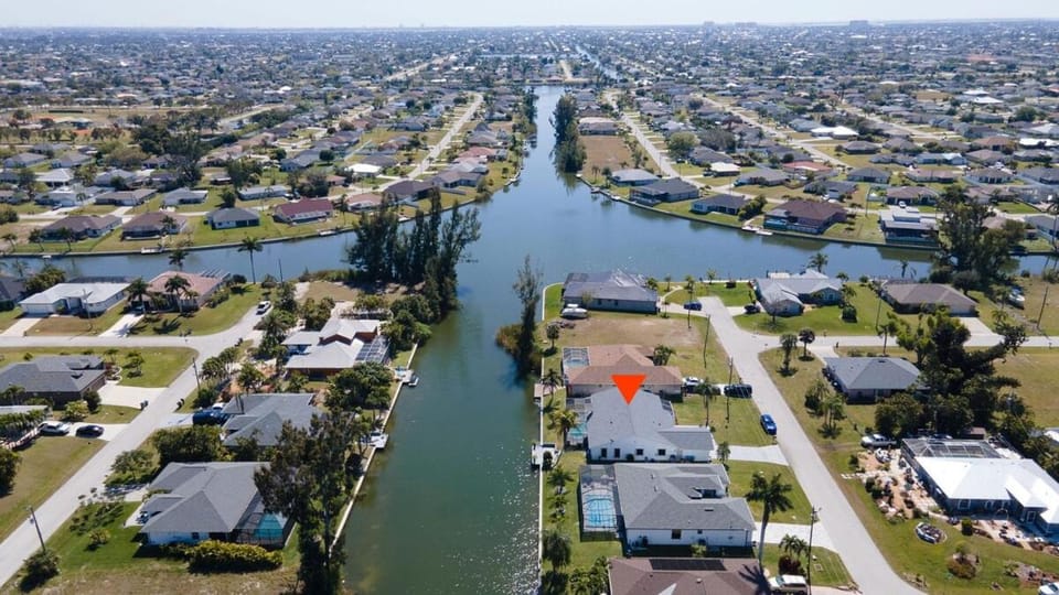 Waterfront Escape with Wild Owl Charm, Heated Pool & Pet-Friendly House in Cape Coral