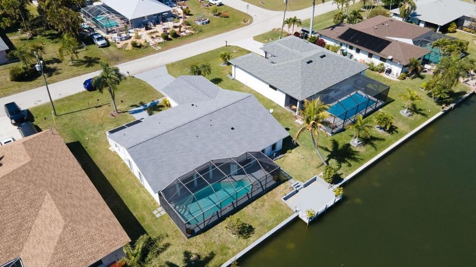 Waterfront Escape with Wild Owl Charm, Heated Pool & Pet-Friendly House in Cape Coral