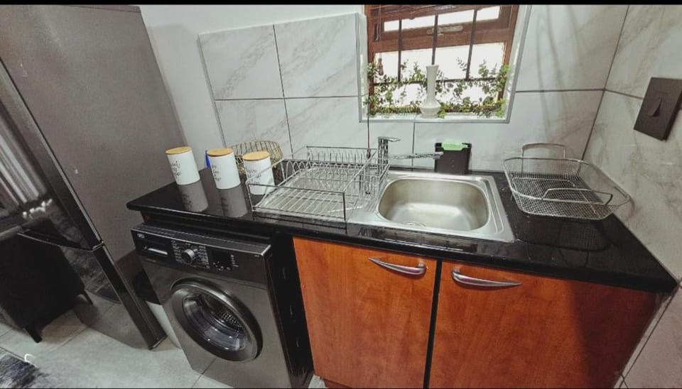Kitchen or kitchenette, washing machine