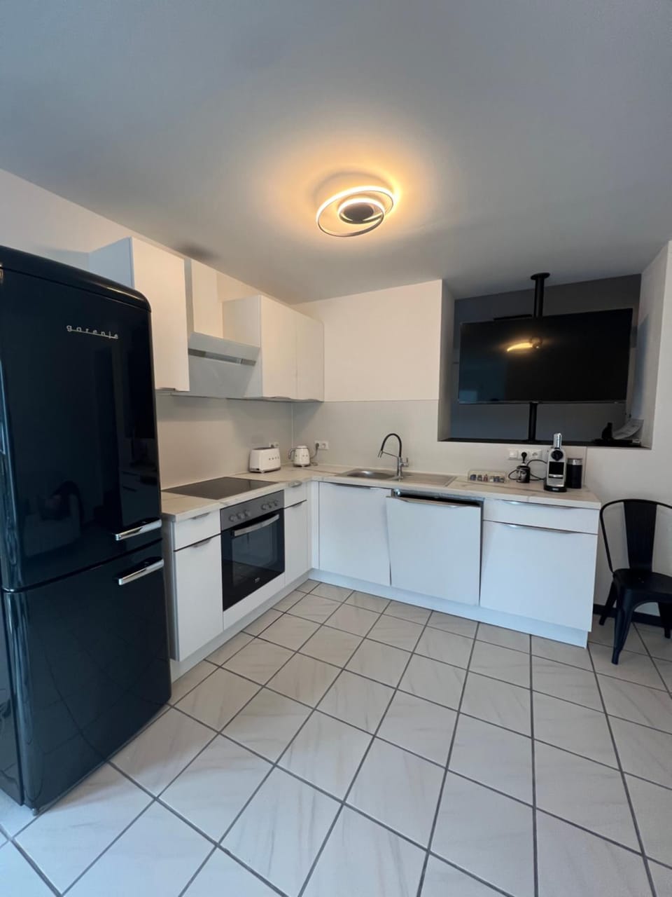 Kitchen or kitchenette, dishwasher, stove, toaster