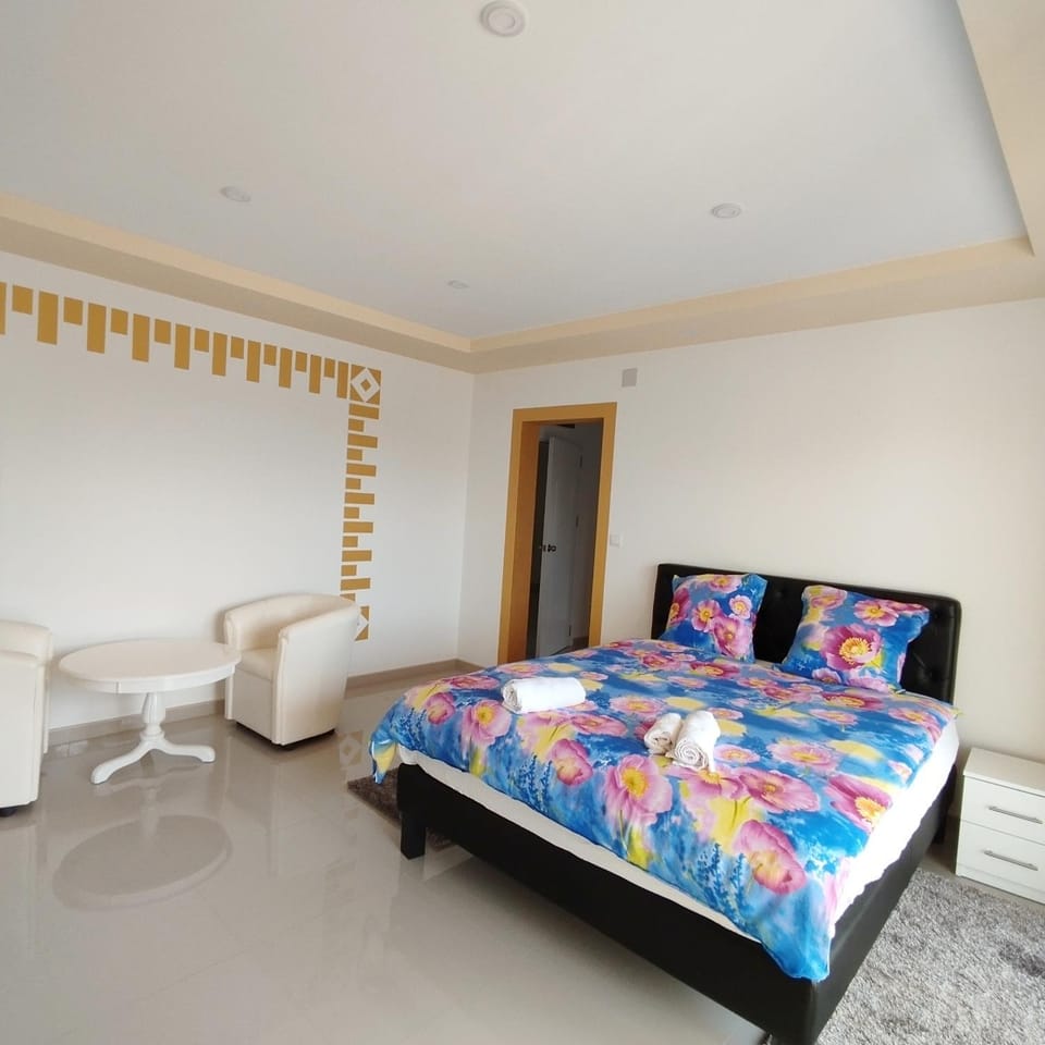 Toilet, Bed, Bathroom, Seating area, Bedroom, towels