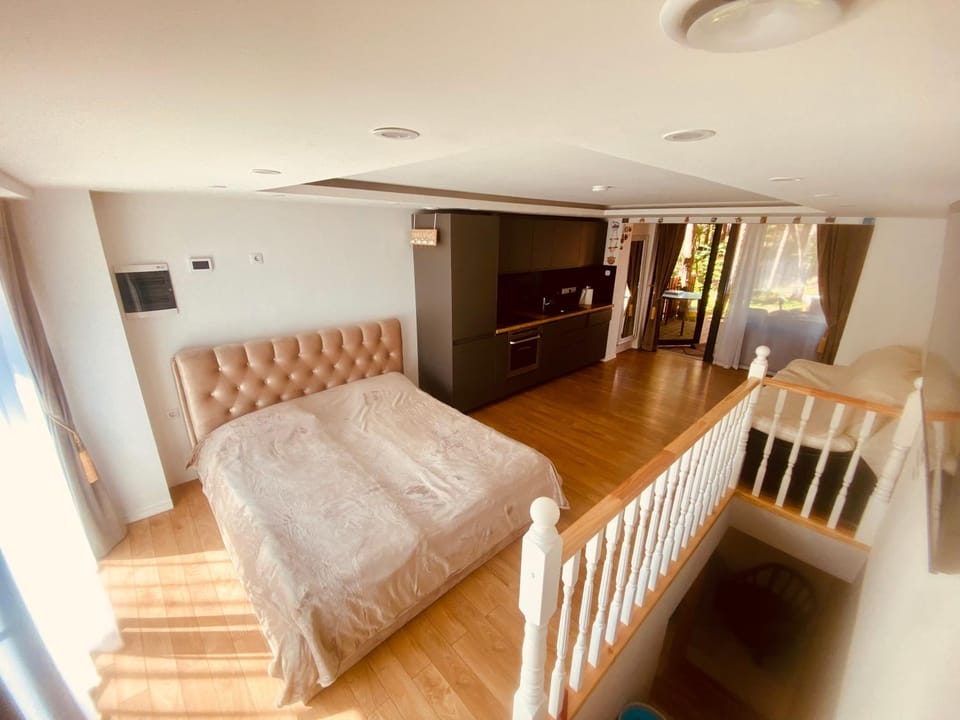 Bed, Living room, Seating area, Bedroom