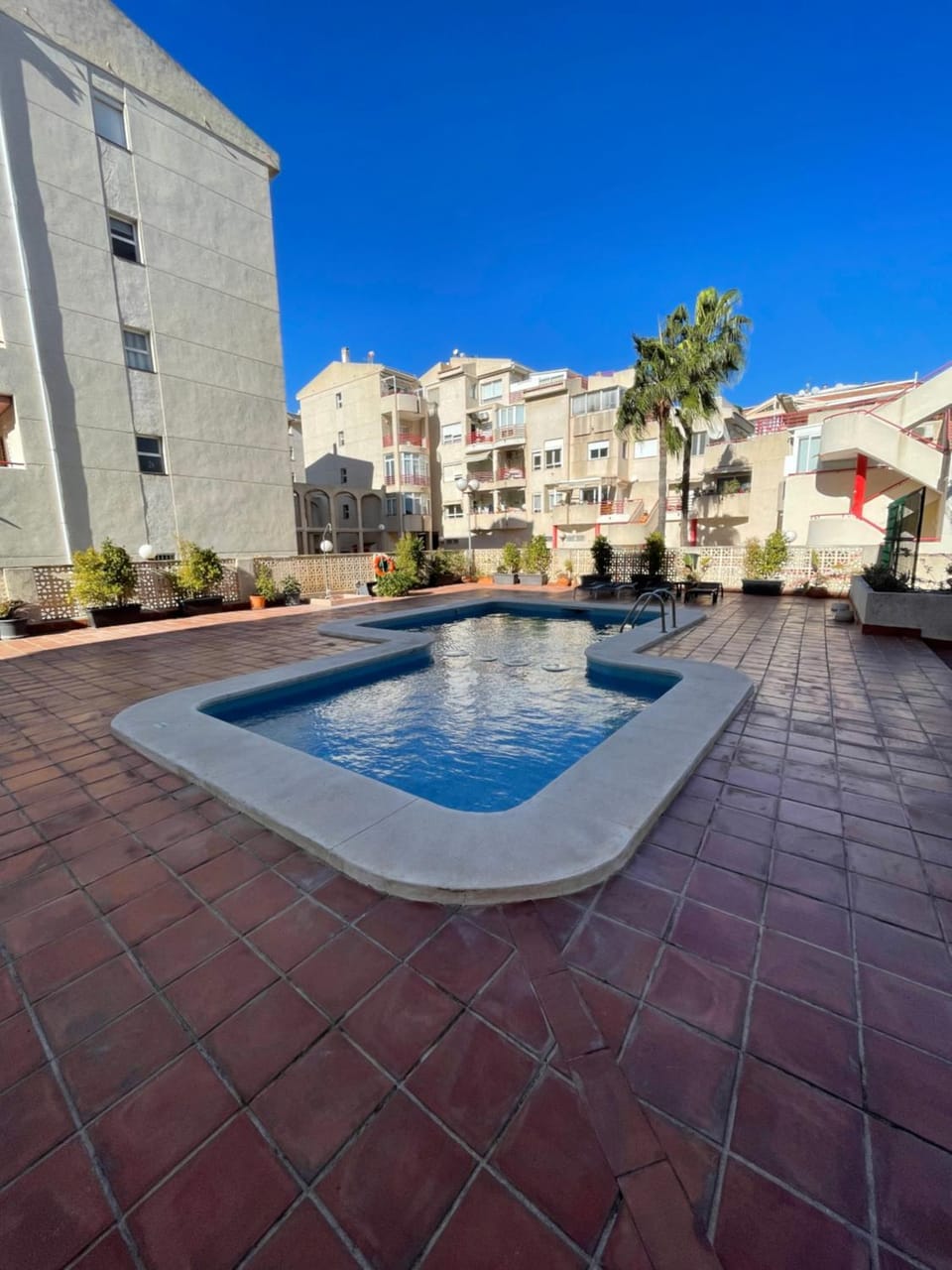 Swimming pool, sunbed