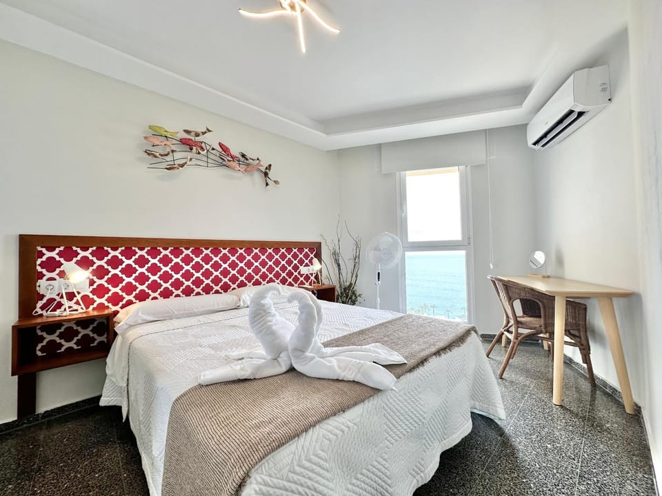Bed, TV and multimedia, Seating area, Bedroom, Sea view, air conditioner