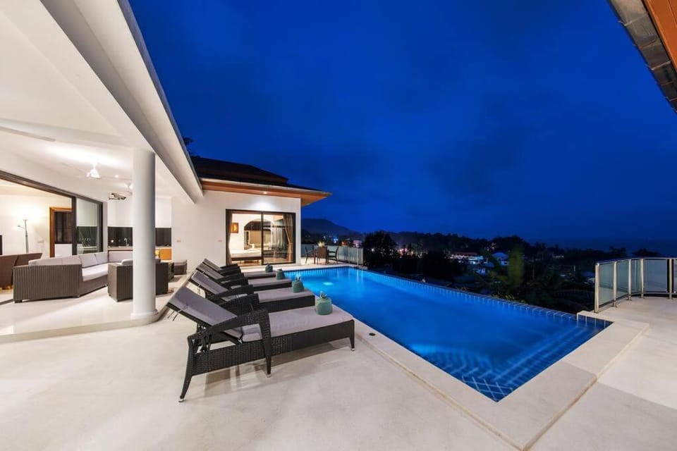 Property building, Patio, Night, Natural landscape, Pool view, Swimming pool, sunbed