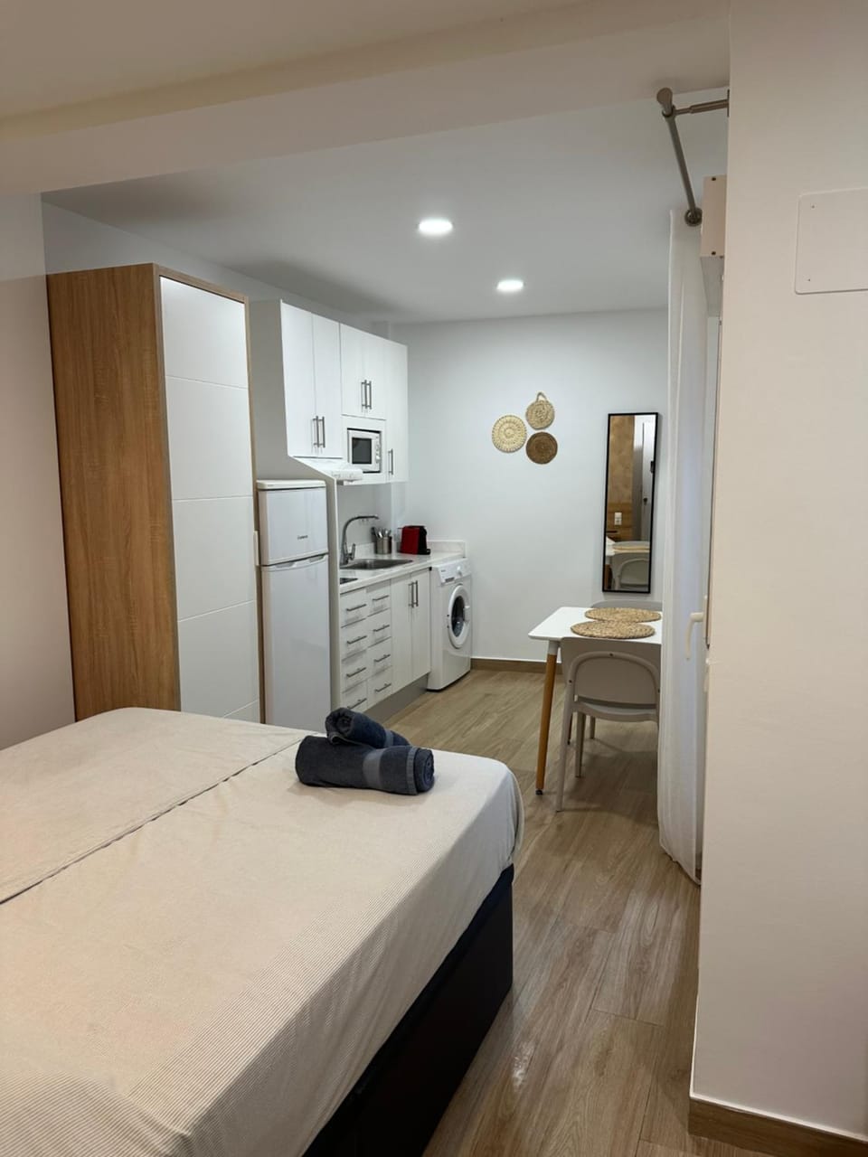 Bed, washing machine, kitchen