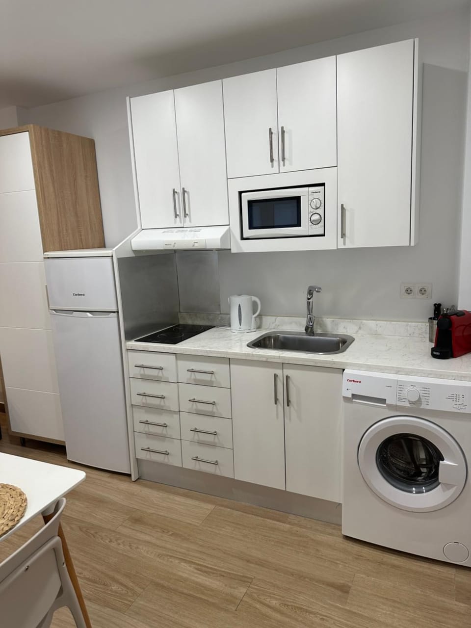Kitchen or kitchenette, washing machine