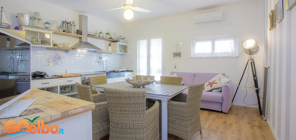 TV and multimedia, Kitchen or kitchenette, Living room, Seating area, Dining area, oven, air conditioner