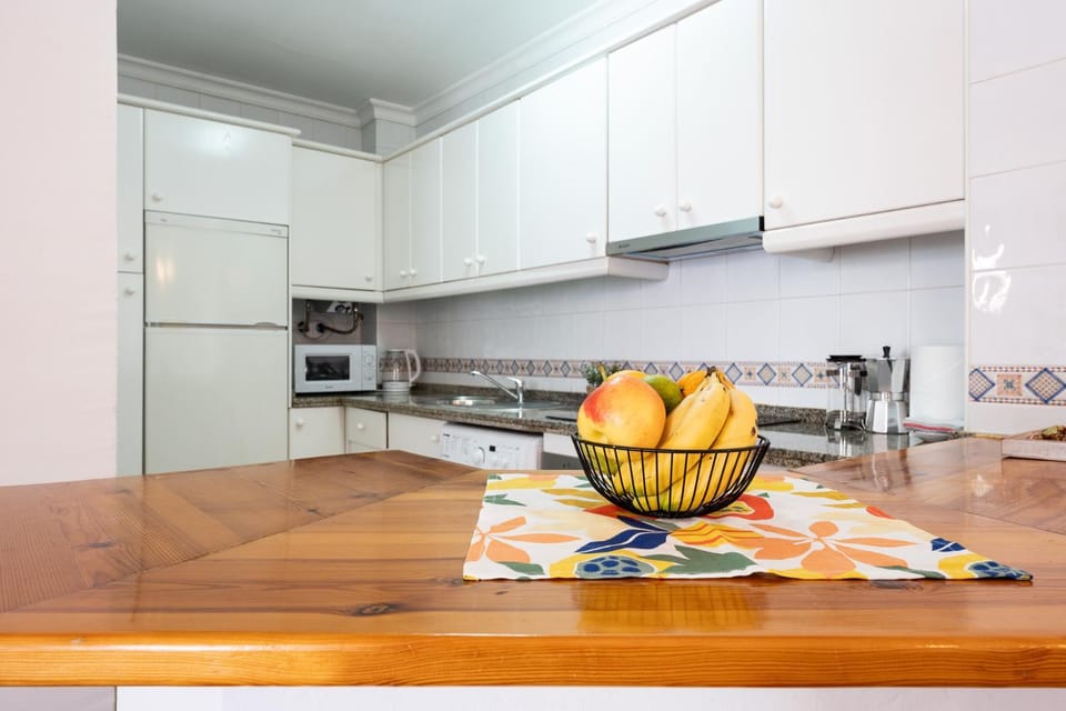 Kitchen or kitchenette, Dining area, microwave, oven, stove, toaster, washing machine