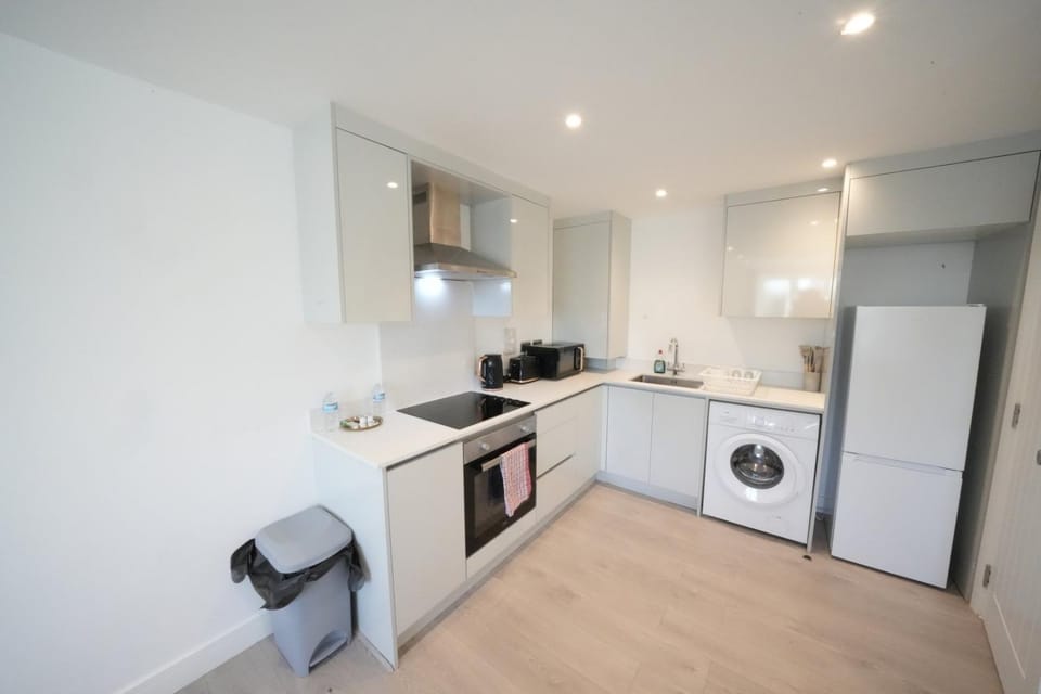 Kitchen or kitchenette, oven, stove, washing machine