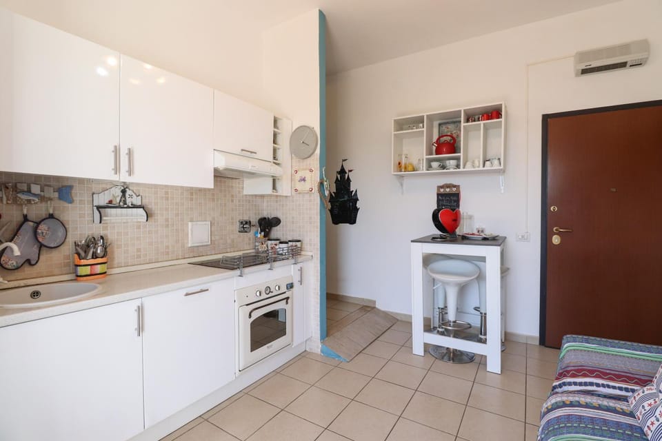 Kitchen or kitchenette, dishwasher, oven, stove, toaster