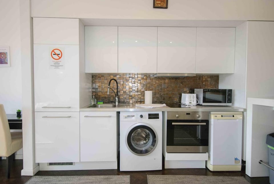 Kitchen or kitchenette, dishwasher, oven, stove, washing machine