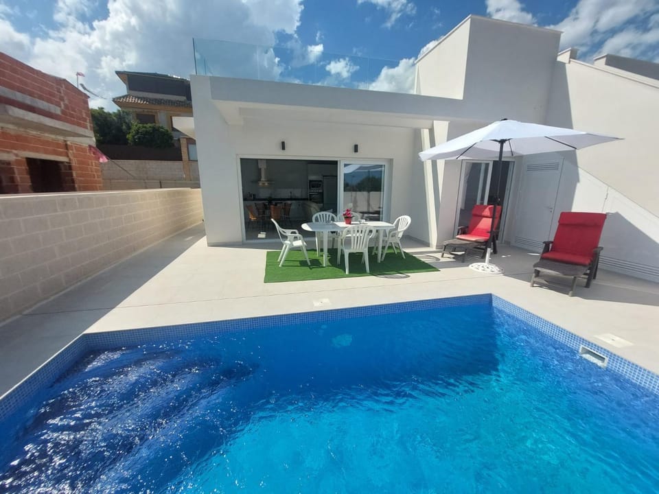 Patio, Day, Seating area, Pool view, Swimming pool, sunbed