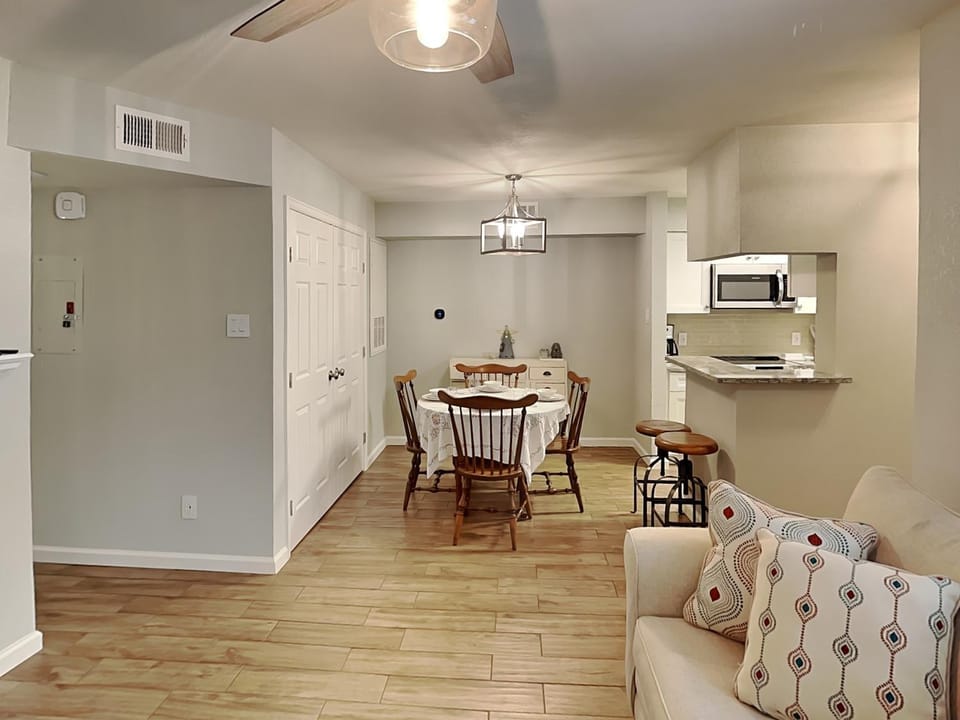 Kitchen or kitchenette, Living room, Seating area, Dining area, furniture, microwave, air conditioner