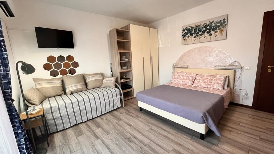 Bed, Living room, Seating area, Bedroom