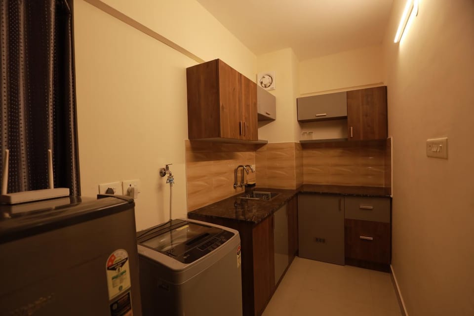 Kitchen or kitchenette, dishwasher, stove, washing machine